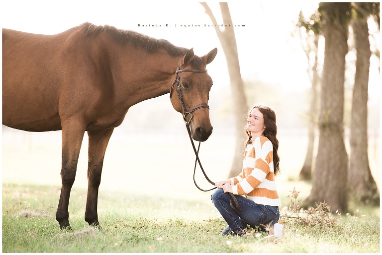 bay horse outdoor portrait with rider kneeling texas photographer 