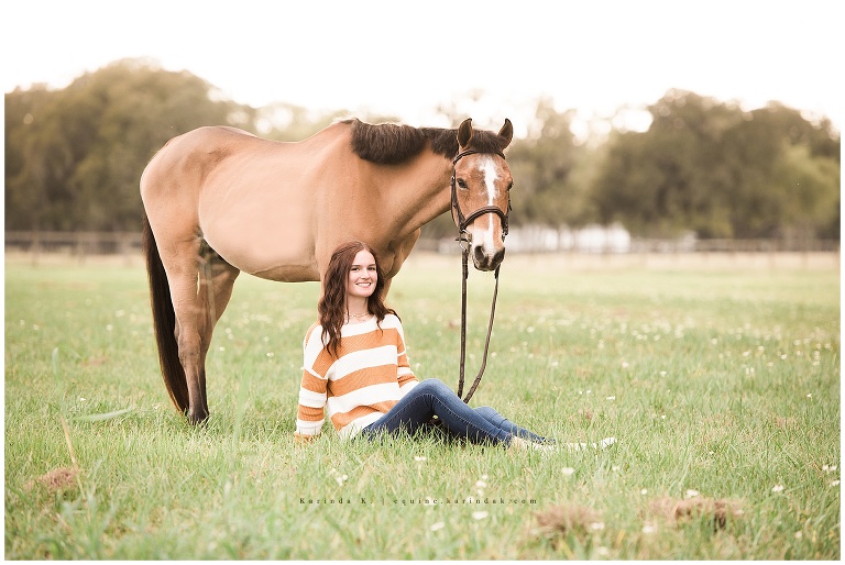 horse and rider senior portraits sitting in field poses 